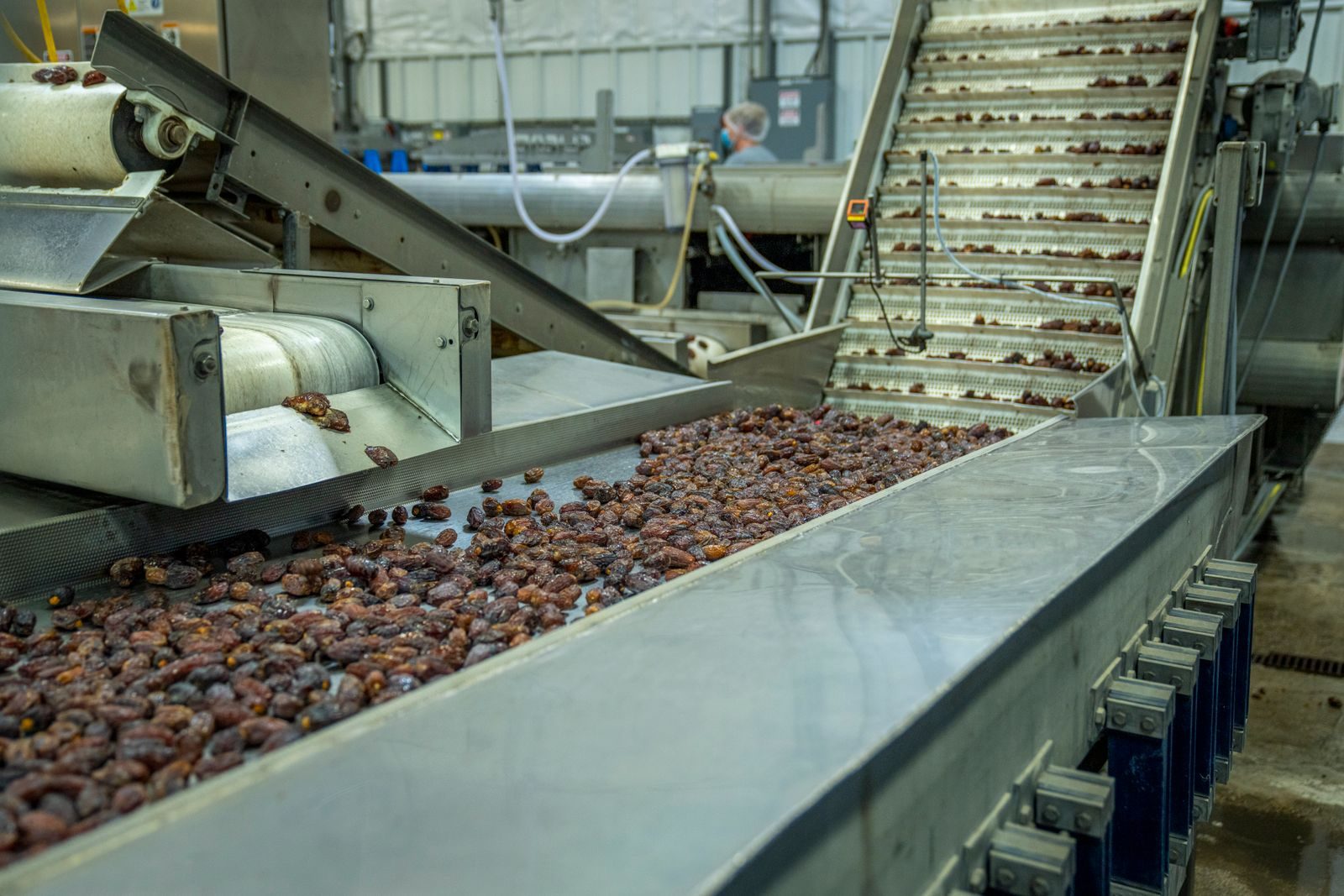 A manufacturing line with finished products moving through a clean industrial facility.